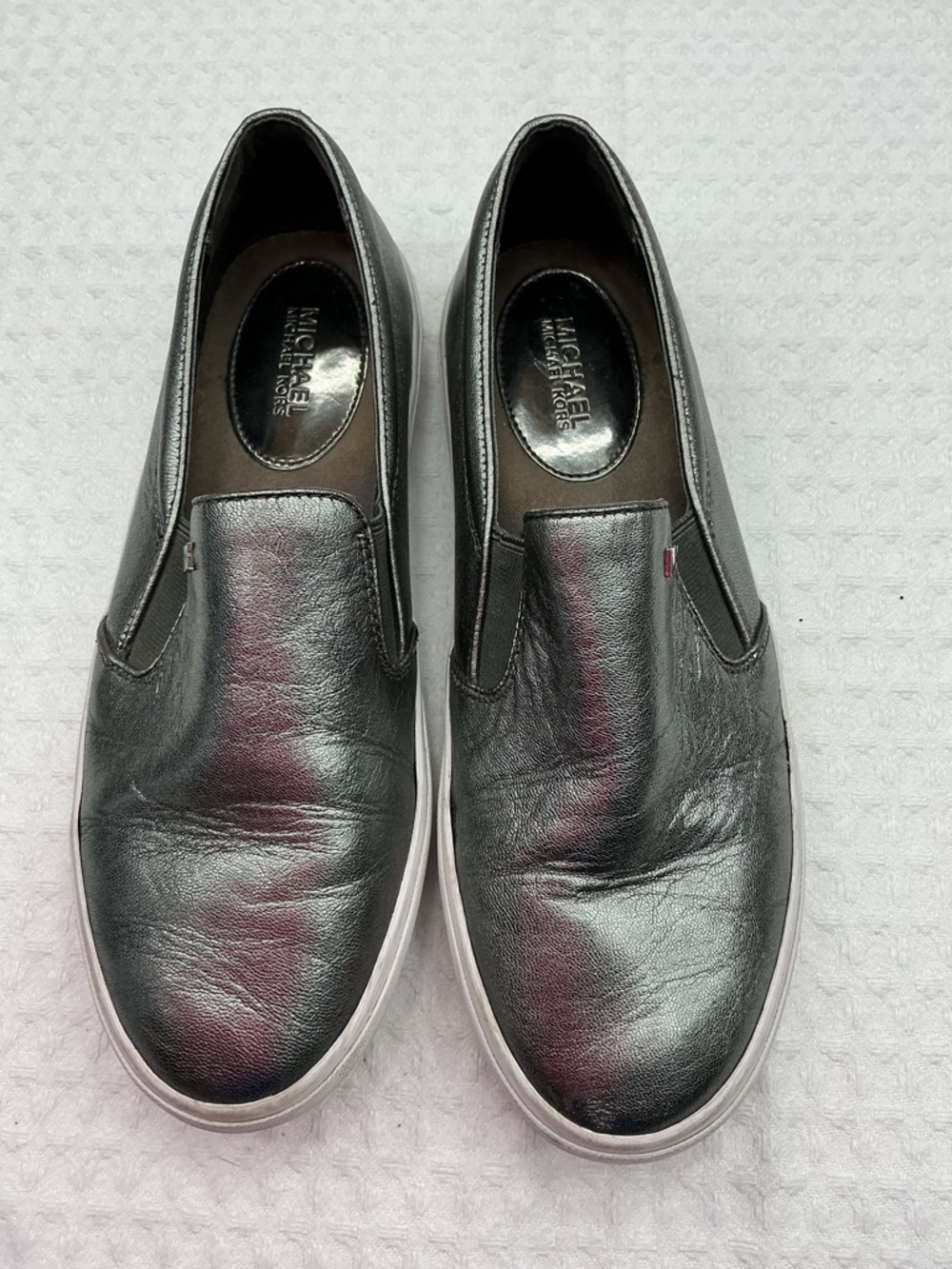 MICHAEL Michael Kors women’s Black Leather Slip-On Sneakers with White Sole